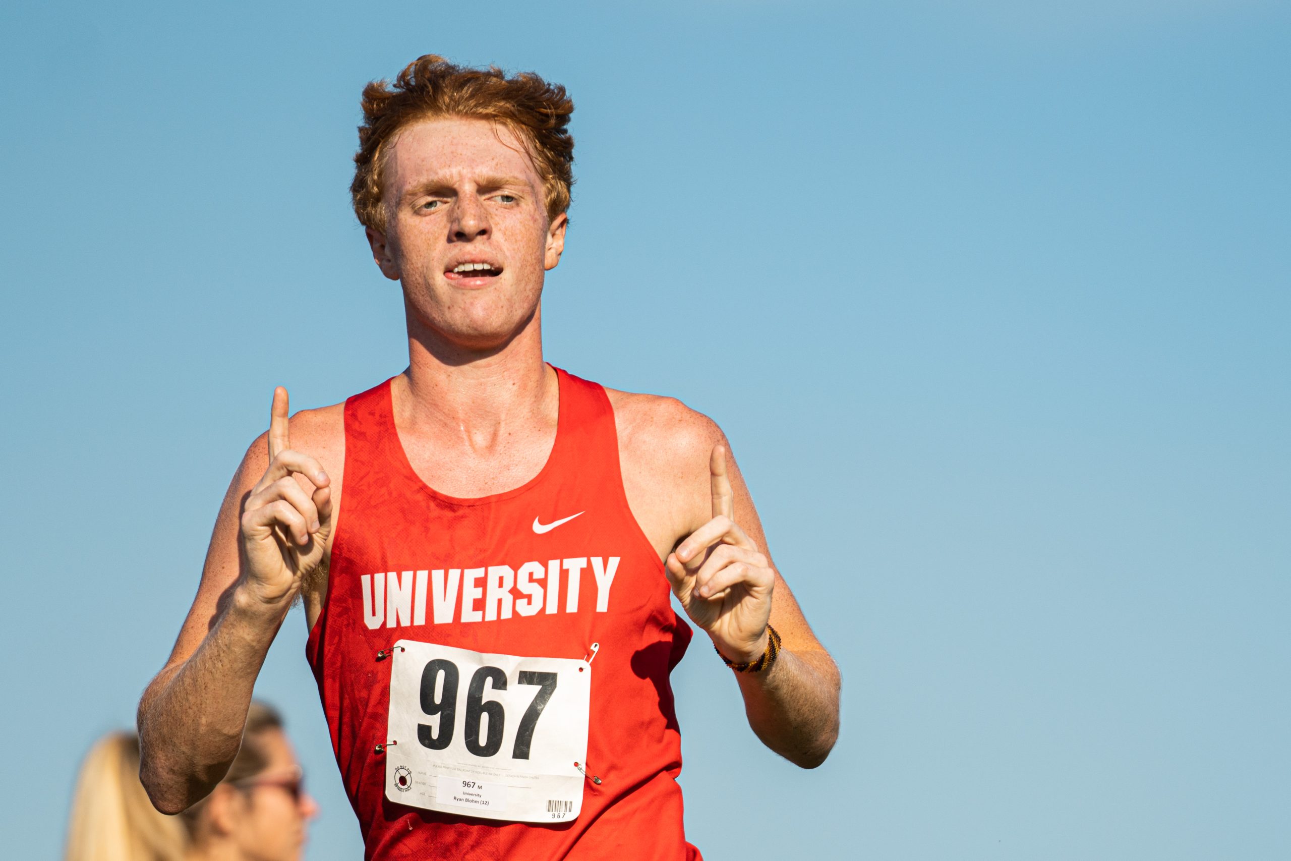 Ryan Blohm leads UHS cross-country to a perfect score; Irene Riggs leads MHS to another regional title
